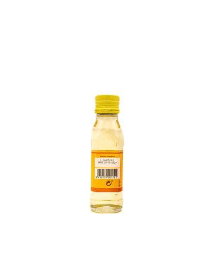Bottle of oil with a yellow cap on a white background