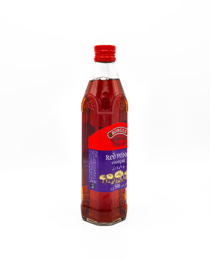 Bottle of Red Wine Vinegar with a red cap on a white background