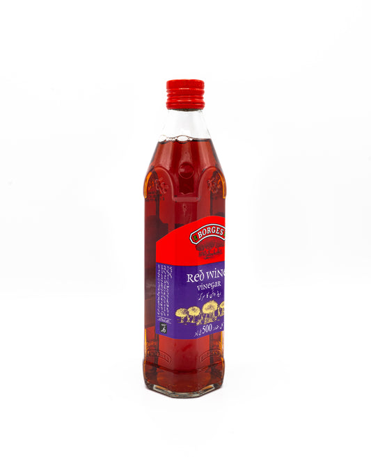Bottle of Red Wine Vinegar with a red cap on a white background