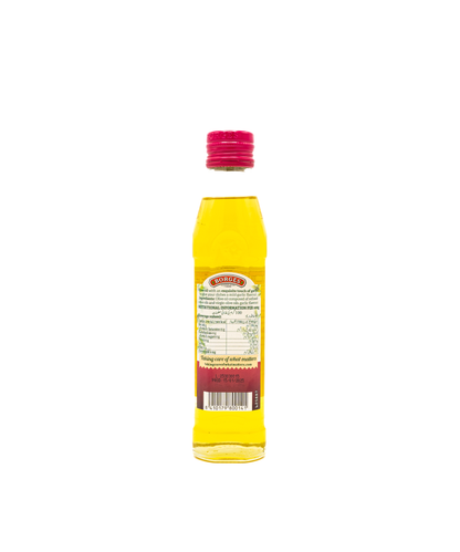 Yellow bottle with a red cap on a white background